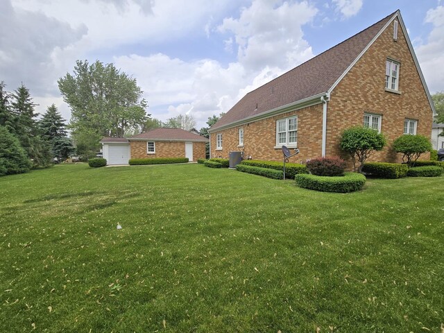 210 S Ridge St, Shannon, IL 61078 - view of property exterior with brick siding, a lawn, and central AC