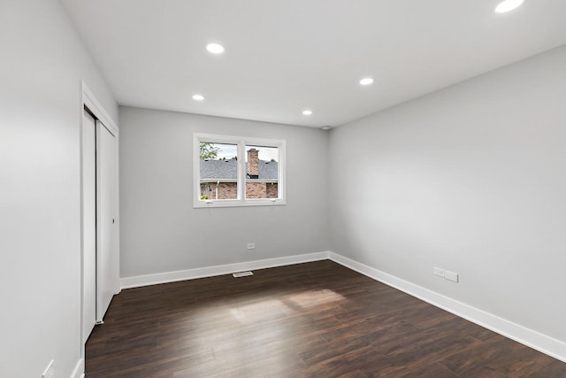 7729 W 157th Pl, Orland Park, IL 60462 - unfurnished bedroom with recessed lighting, baseboards, dark wood-type flooring, and a closet