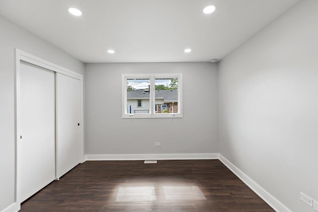 7729 W 157th Pl, Orland Park, IL 60462 - unfurnished bedroom with recessed lighting, baseboards, a closet, and dark wood-style floors