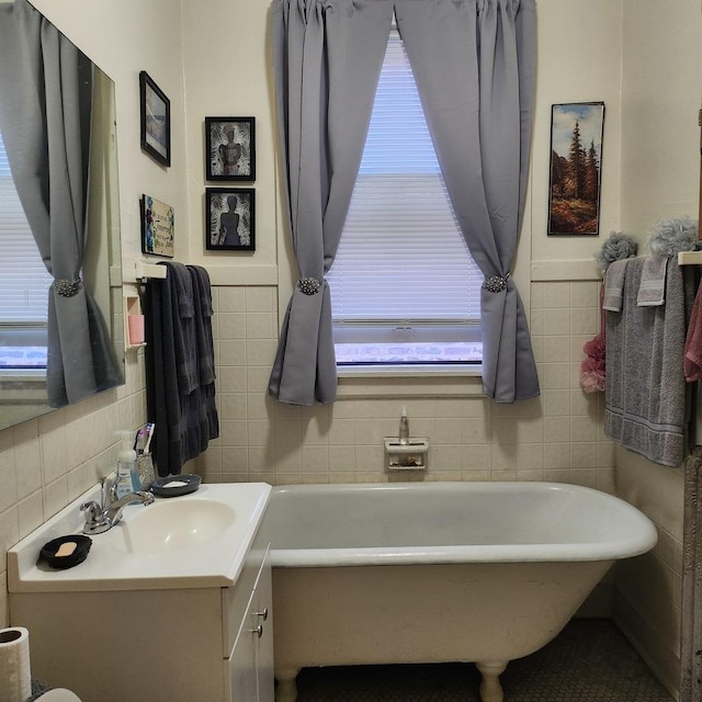 7601 S Morgan St, Chicago, IL 60620 - full bathroom with tile walls, a soaking tub, and vanity