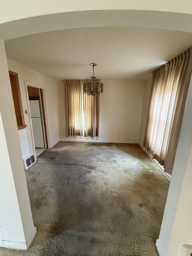 2452 S 6th Ave, North Riverside, IL 60546 - carpeted spare room featuring a chandelier and baseboards