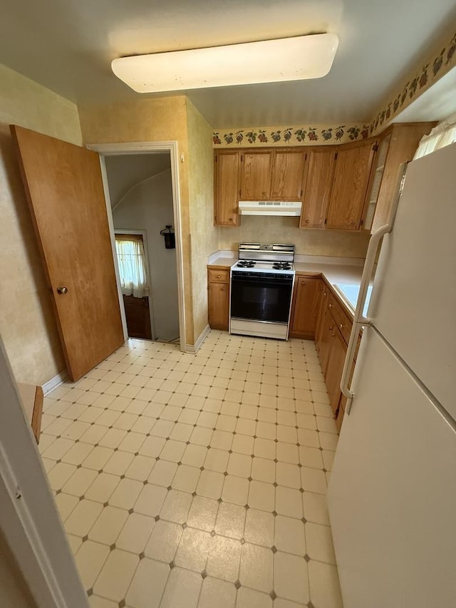2452 S 6th Ave, North Riverside, IL 60546 - kitchen featuring white appliances, under cabinet range hood, light countertops, brown cabinetry, and light flooring