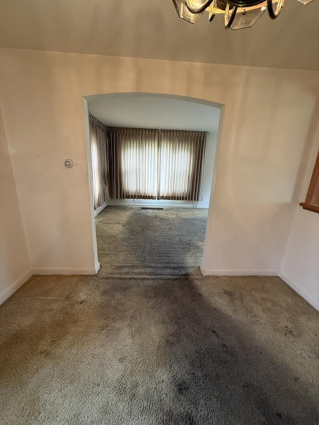 2452 S 6th Ave, North Riverside, IL 60546 - unfurnished room featuring carpet, baseboards, and a chandelier