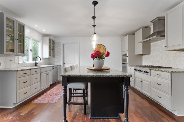 26 Fox Ln, Palos Park, IL 60464 - kitchen featuring stainless steel appliances, wall chimney range hood, backsplash, dark wood-style flooring, and recessed lighting