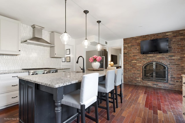 26 Fox Ln, Palos Park, IL 60464 - kitchen with wall chimney exhaust hood, backsplash, light stone countertops, white cabinets, and a sink