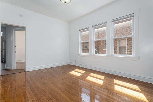 2439 S Millard Ave, Chicago, IL 60623 - spare room with baseboards and hardwood / wood-style floors