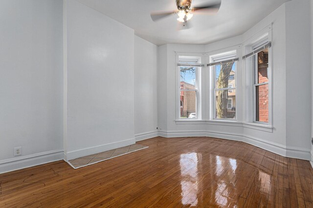 2439 S Millard Ave, Chicago, IL 60623 - spare room featuring a ceiling fan, hardwood / wood-style flooring, and baseboards