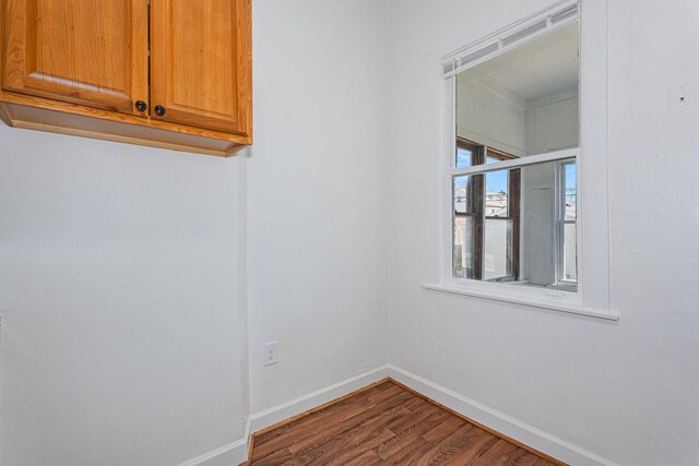 2439 S Millard Ave, Chicago, IL 60623 - unfurnished room featuring dark wood-style flooring and baseboards