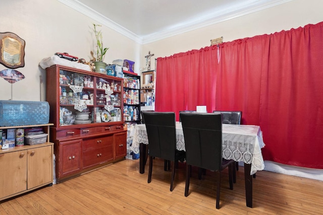 2439 S Millard Ave, Chicago, IL 60623 - dining space with ornamental molding and hardwood / wood-style flooring