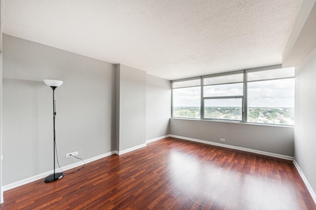7234 W N Ave Unit 1608, Elmwood Park, IL 60707 - empty room featuring wood finished floors, baseboards, and a textured ceiling