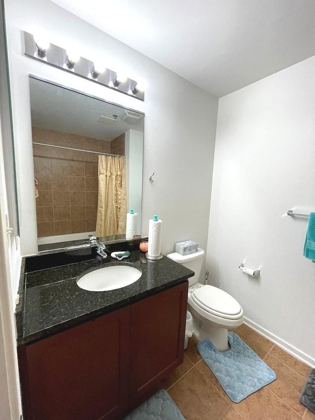 bathroom with vanity, tile patterned flooring, toilet, and a shower with curtain