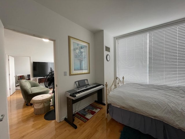 bedroom featuring wood finished floors