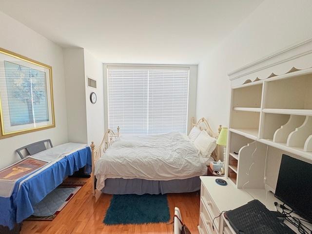 bedroom featuring wood finished floors