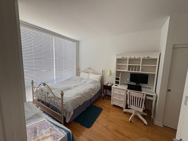 bedroom with light wood finished floors