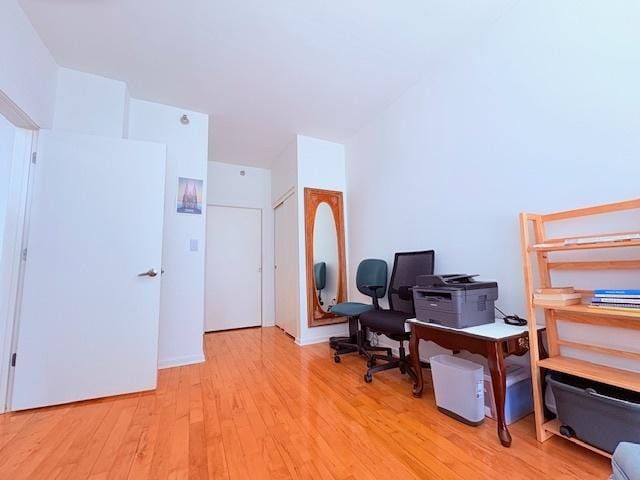 office space with light wood-type flooring