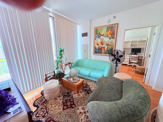 living room featuring wood finished floors and plenty of natural light