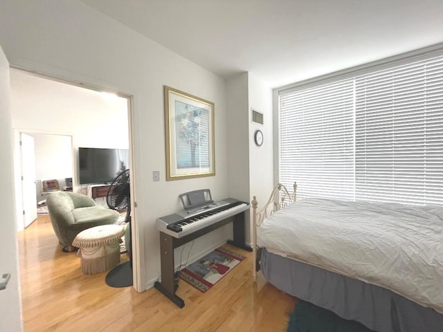 bedroom with wood finished floors