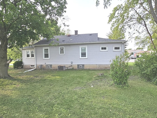 3500 Butler Ave, Steger, IL 60475 - rear view of house featuring a lawn, a chimney, central AC unit, and roof with shingles