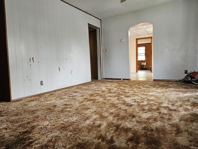 3500 Butler Ave, Steger, IL 60475 - carpeted spare room featuring arched walkways and wood walls
