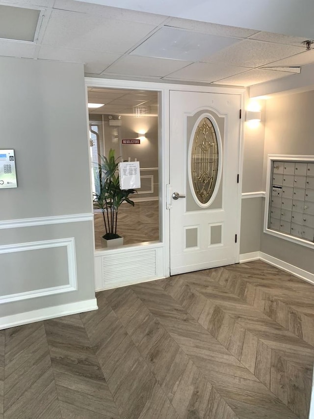 6430 W Belle Plaine Ave Unit 202, Chicago, IL 60634 - foyer entrance featuring mail area and a paneled ceiling