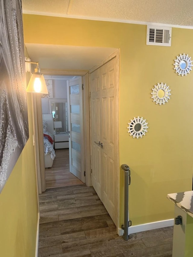 6430 W Belle Plaine Ave Unit 202, Chicago, IL 60634 - corridor with dark wood-type flooring and baseboards