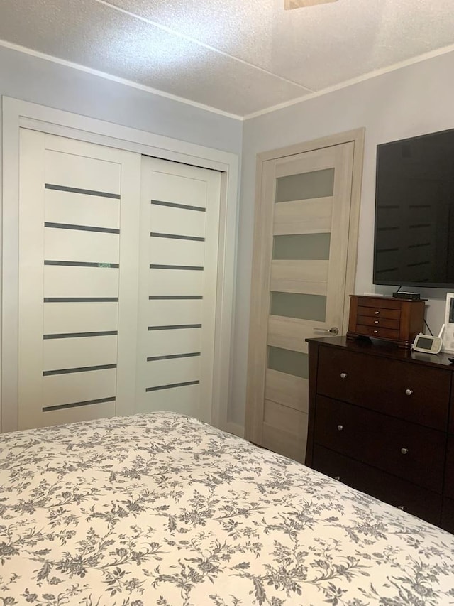 6430 W Belle Plaine Ave Unit 202, Chicago, IL 60634 - bedroom with a closet and ornamental molding