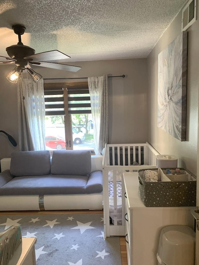 6430 W Belle Plaine Ave Unit 202, Chicago, IL 60634 - bedroom featuring a textured ceiling and a ceiling fan