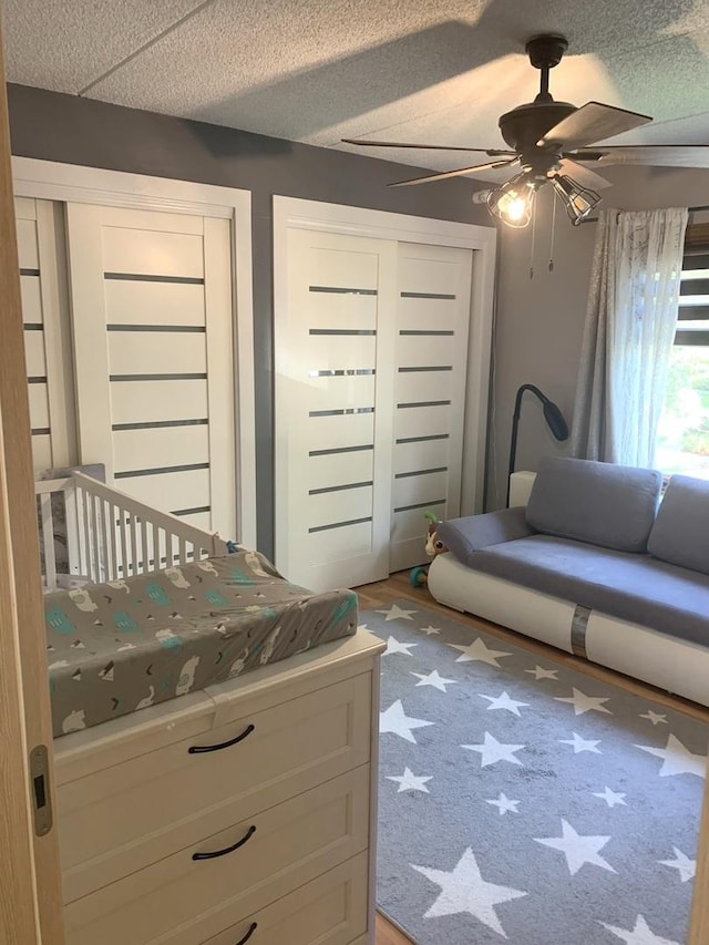 6430 W Belle Plaine Ave Unit 202, Chicago, IL 60634 - bedroom featuring two closets and ceiling fan