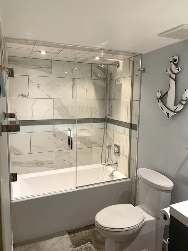 6430 W Belle Plaine Ave Unit 202, Chicago, IL 60634 - bathroom featuring vanity, toilet, and bath / shower combo with glass door