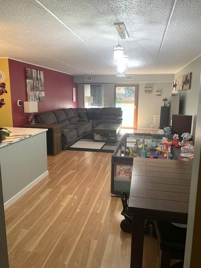 6430 W Belle Plaine Ave Unit 202, Chicago, IL 60634 - living room with wood finished floors and a textured ceiling