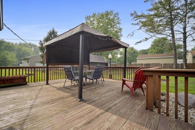 211 S E St, Hudson, IL 61748 - deck with outdoor dining space