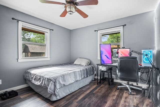 211 S E St, Hudson, IL 61748 - bedroom with multiple windows, wood finished floors, and baseboards