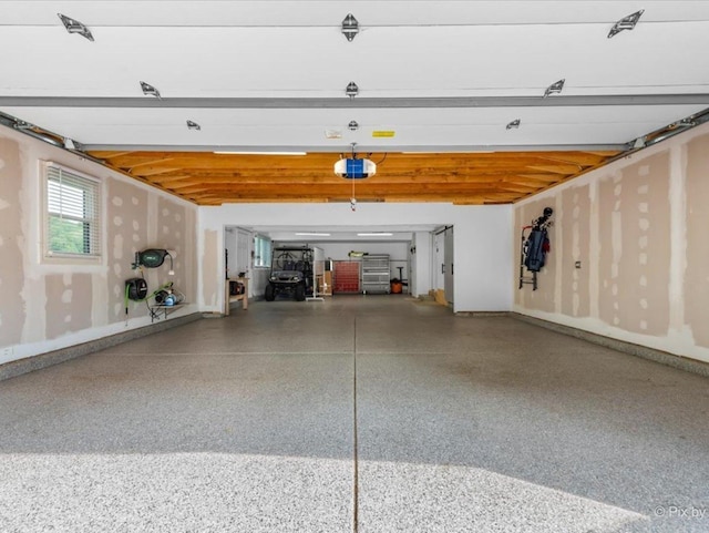 1599 Lowe Dr, Algonquin, IL 60102 - garage featuring a garage door opener and baseboards