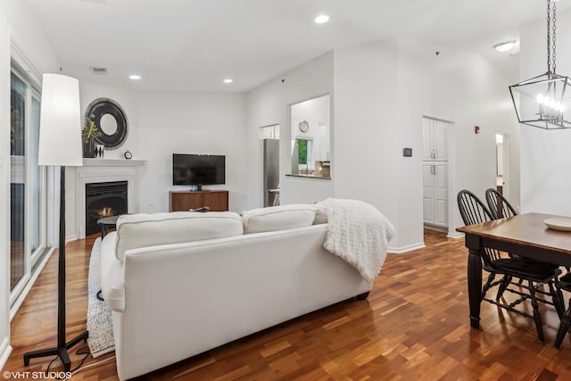 4400 Pershing Ave Unit 3S, Downers Grove, IL 60515 - living area with a warm lit fireplace, wood finished floors, a chandelier, and recessed lighting