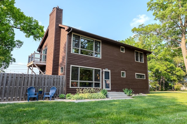 545 Delaware Dr, Lake In The Hills, IL 60156 - rear view of house with a chimney and a balcony