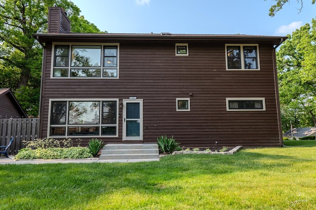 545 Delaware Dr, Lake In The Hills, IL 60156 - rear view of house with a chimney