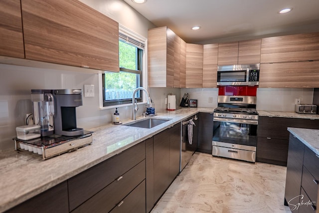 545 Delaware Dr, Lake In The Hills, IL 60156 - kitchen with appliances with stainless steel finishes, light stone countertops, recessed lighting, and modern cabinets