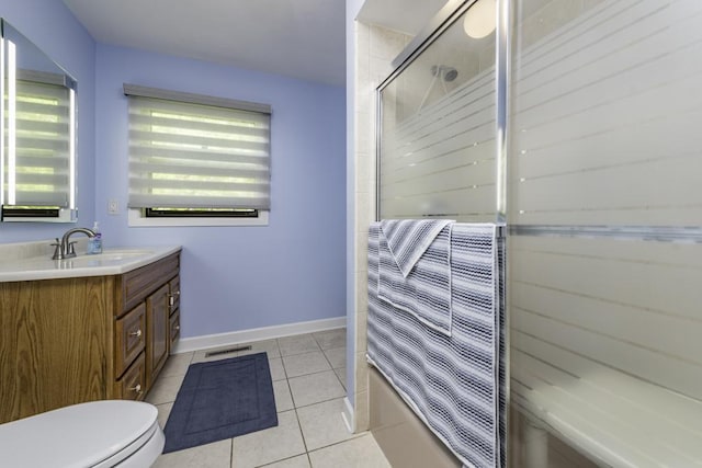 1401 Funderburk Dr, Winthrop Harbor, IL 60096 - full bath featuring toilet, vanity, tile patterned flooring, shower / bath combination with glass door, and baseboards