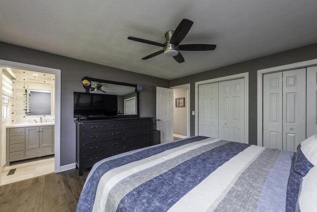 1401 Funderburk Dr, Winthrop Harbor, IL 60096 - bedroom with dark wood-style flooring, multiple closets, baseboards, ceiling fan, and ensuite bath