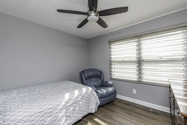 1401 Funderburk Dr, Winthrop Harbor, IL 60096 - bedroom featuring dark wood-style flooring, baseboards, and ceiling fan
