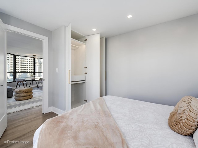 405 N Wabash Ave Unit 2313, Chicago, IL 60611 - bedroom with wood finished floors, baseboards, and recessed lighting
