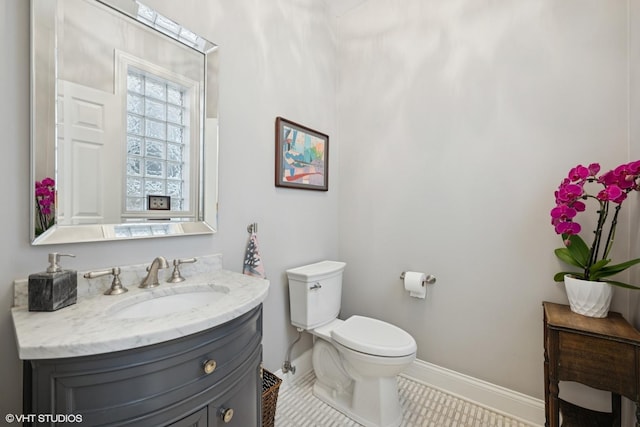 2319 W Shakespeare St, Chicago, IL 60647 - bathroom with vanity, baseboards, and toilet