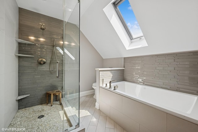 2319 W Shakespeare St, Chicago, IL 60647 - full bathroom featuring a skylight, a stall shower, toilet, a bath, and lofted ceiling