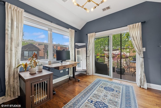 2319 W Shakespeare St, Chicago, IL 60647 - office area featuring a chandelier, vaulted ceiling, wood finished floors, and baseboards
