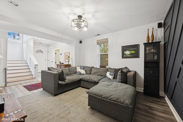 2319 W Shakespeare St, Chicago, IL 60647 - living area with stairs, wood finished floors, and baseboards