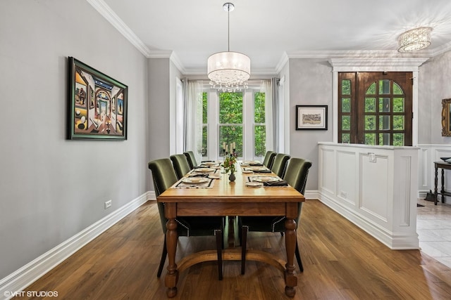 2319 W Shakespeare St, Chicago, IL 60647 - dining area featuring a chandelier, ornamental molding, wood finished floors, and baseboards