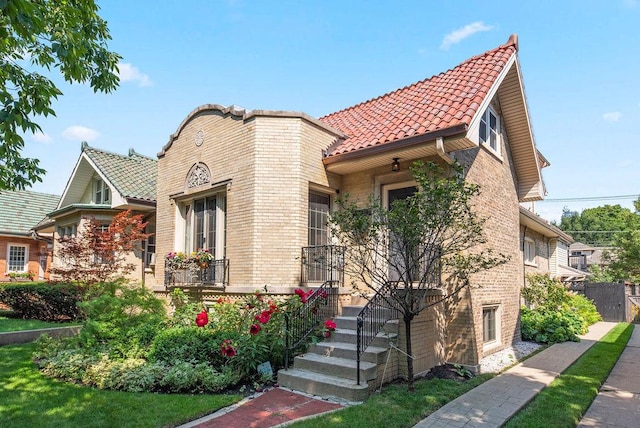 2530 W Morse Ave, Chicago, IL 60645 - view of front of house with a tiled roof and brick siding