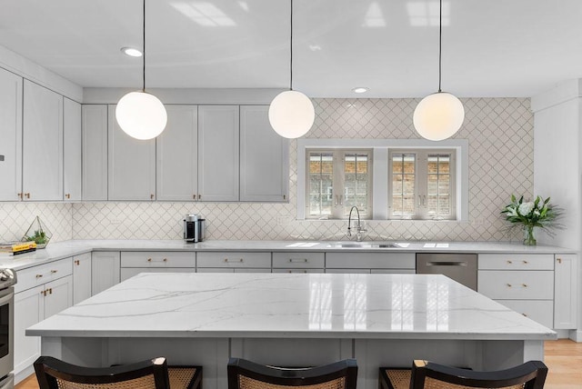 2530 W Morse Ave, Chicago, IL 60645 - kitchen featuring dishwasher, a kitchen bar, tasteful backsplash, light stone countertops, and recessed lighting
