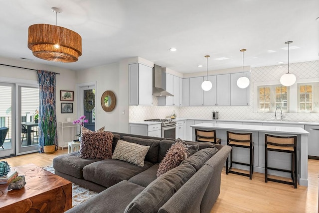 2530 W Morse Ave, Chicago, IL 60645 - living area with light wood-style flooring and recessed lighting