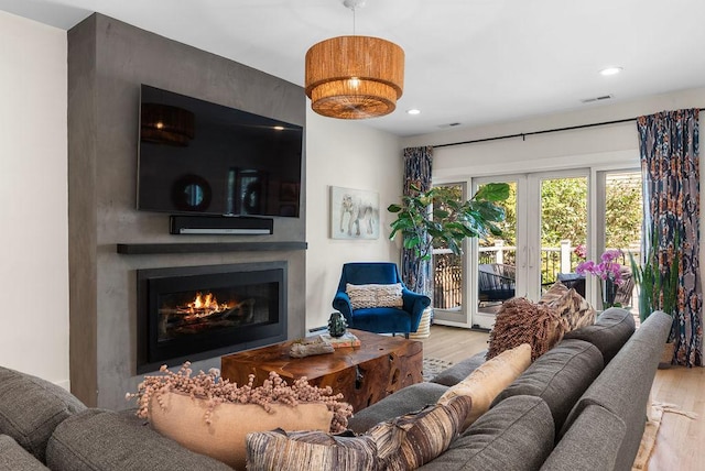 2530 W Morse Ave, Chicago, IL 60645 - living room with wood finished floors, a large fireplace, and recessed lighting